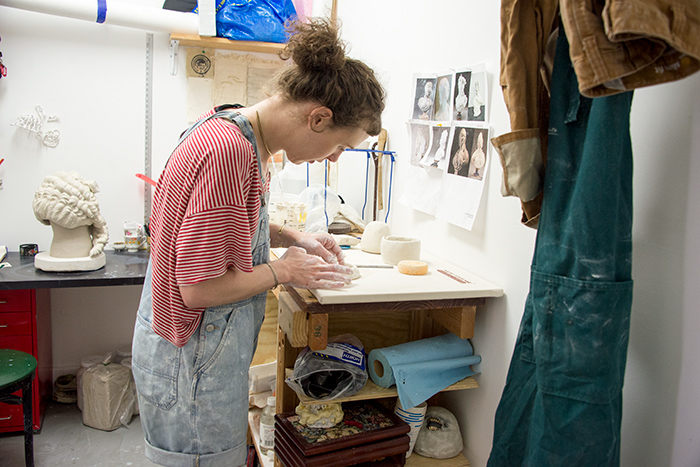 Juliana Wisdom begins work on a porcelain maquette in her studio. Photo by Kate Lain.
