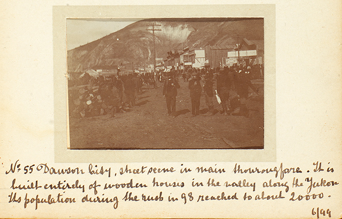 Detail of a page from Alfred and Charles O’Meara’s photograph album showing a street scene in the bustling boomtown of Dawson City, June 1899. Unidentified photographer. The Huntington Library, Art Collections, and Botanical Gardens.