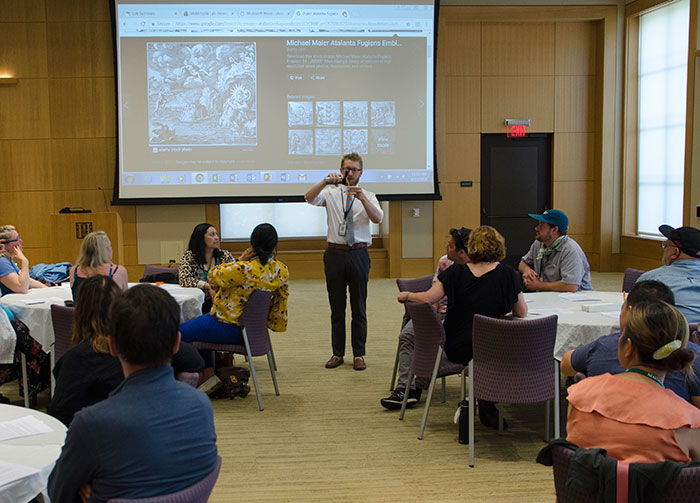 In Haaga Hall, Klein instructs teachers how to make yellow dyes and paints using saffron according to medieval and early-modern recipes. Photo by Lisa Blackburn.