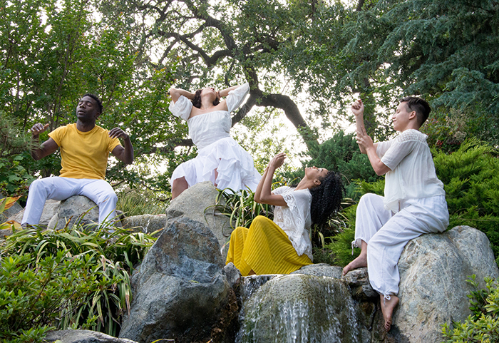Dancers move as if entranced on the rocks of a waterfall in The Huntington’s Japanese Garden. Photo by Deborah Miller.