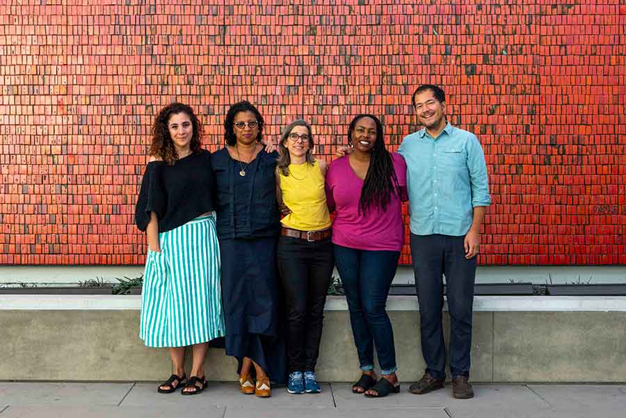 The exhibition “Beside the Edge of the World” features work by the following artists and writers (left to right): Beatriz Santiago Muñoz, Robin Coste Lewis, Nina Katchadourian, Dana Johnson, and Rosten Woo. They stand before Doyle Lane’s Mutual Savings and Loan Mural, 1964, at The Huntington. Photo by Kate Lain. The Huntington Library, Art Museum, and Botanical Gardens.