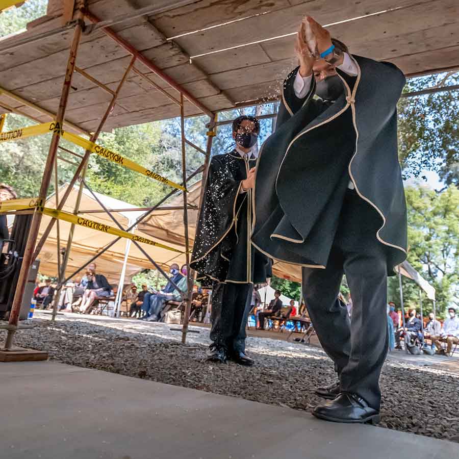 During the roof-raising ceremony, Koji Nakamura and Atsushi Fujimaki of Shumei America sprinkled salt at the entrance of the house in ritual purification. The Huntington Library, Art Museum, and Botanical Gardens. Photo by John Diefenbach