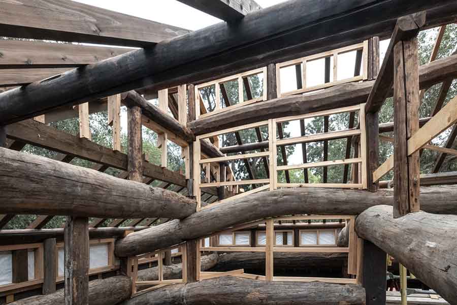 The original roof beams are shown in the reconstructed framework of the house. (Some new framing has been added where use of the original wood was not feasible.) The Huntington Library, Art Museum, and Botanical Gardens. Photo by John Diefenbach.