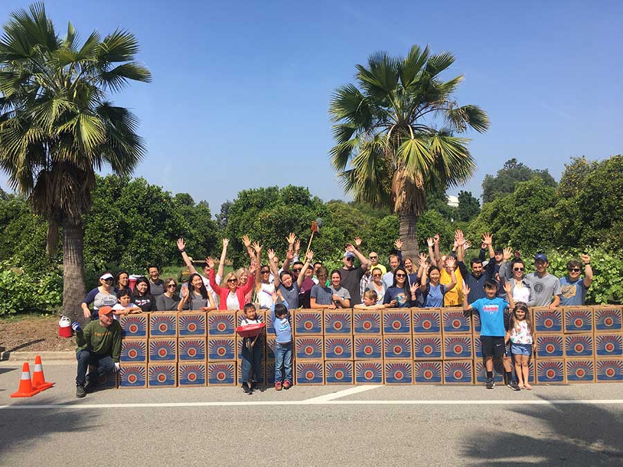 On a recent Saturday, dozens of volunteers harvested more than 3,000 pounds of oranges at The Huntington for hunger relief agencies. Photo by Usha Lee McFarling.