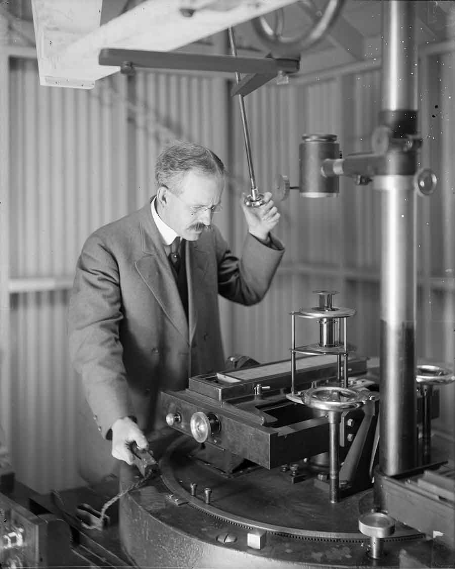 George Ellery Hale, renowned solar astronomer, at the spectrograph of the 60-foot solar tower telescope, Mount Wilson Observatory, ca. 1908. The Observatories of the Carnegie Institution for Science Collection at the Huntington Library, San Marino, Calif.
