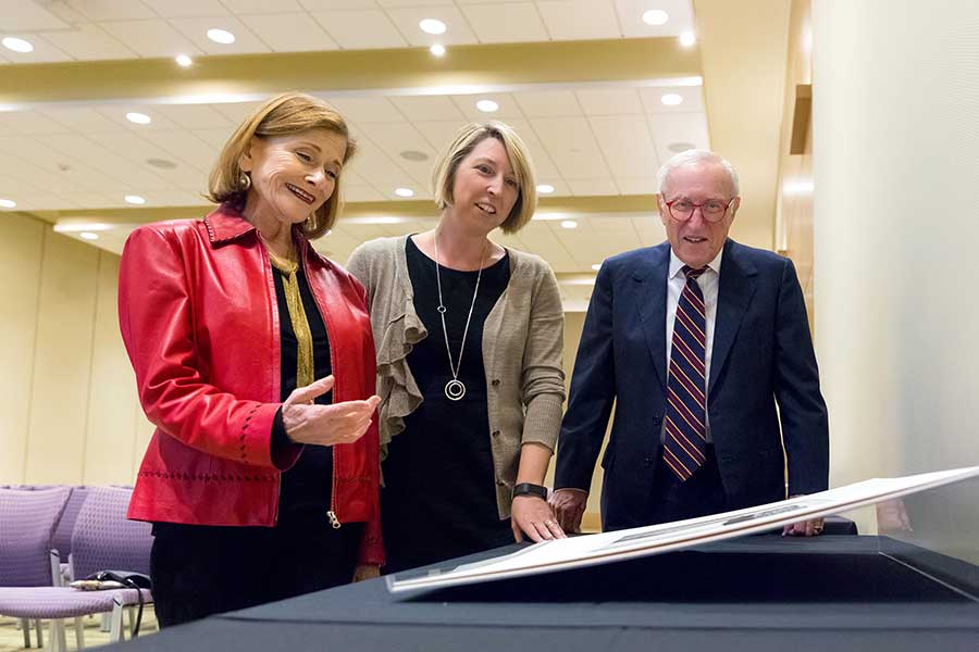 Melinda McCurdy in 2018 with donors Nancy Berman (left) and Alan Bloch (right), looking at a selection of prints by artist Henry Moore, part of a gift from the Philip and Muriel Berman Foundation. Photo by Sarah Golonka.
