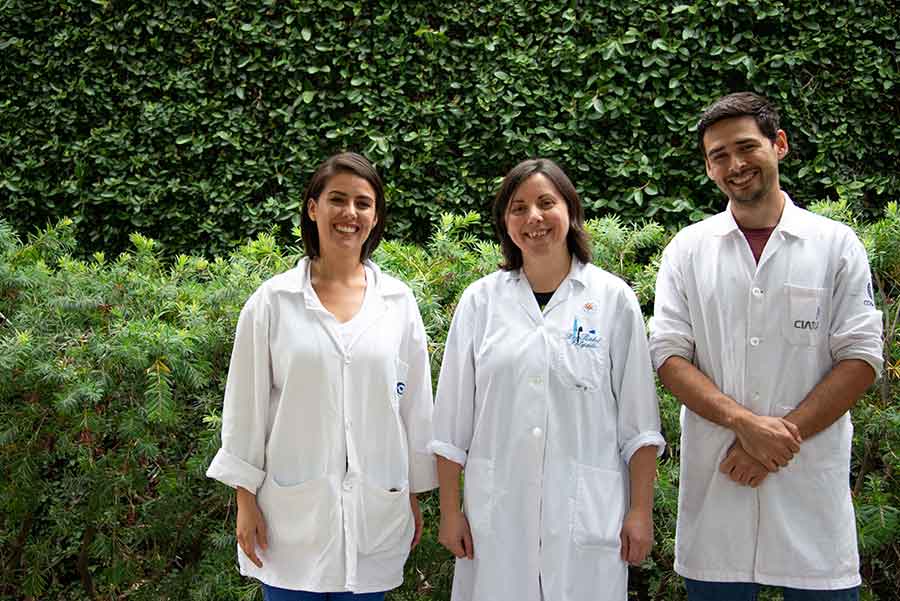 Lourdes Delgado, left, Raquel Folgado, center, and Felipe de Jesús Romo Paz, taking a break outside the cryopreservation lab. Photo by Deborah Miller.